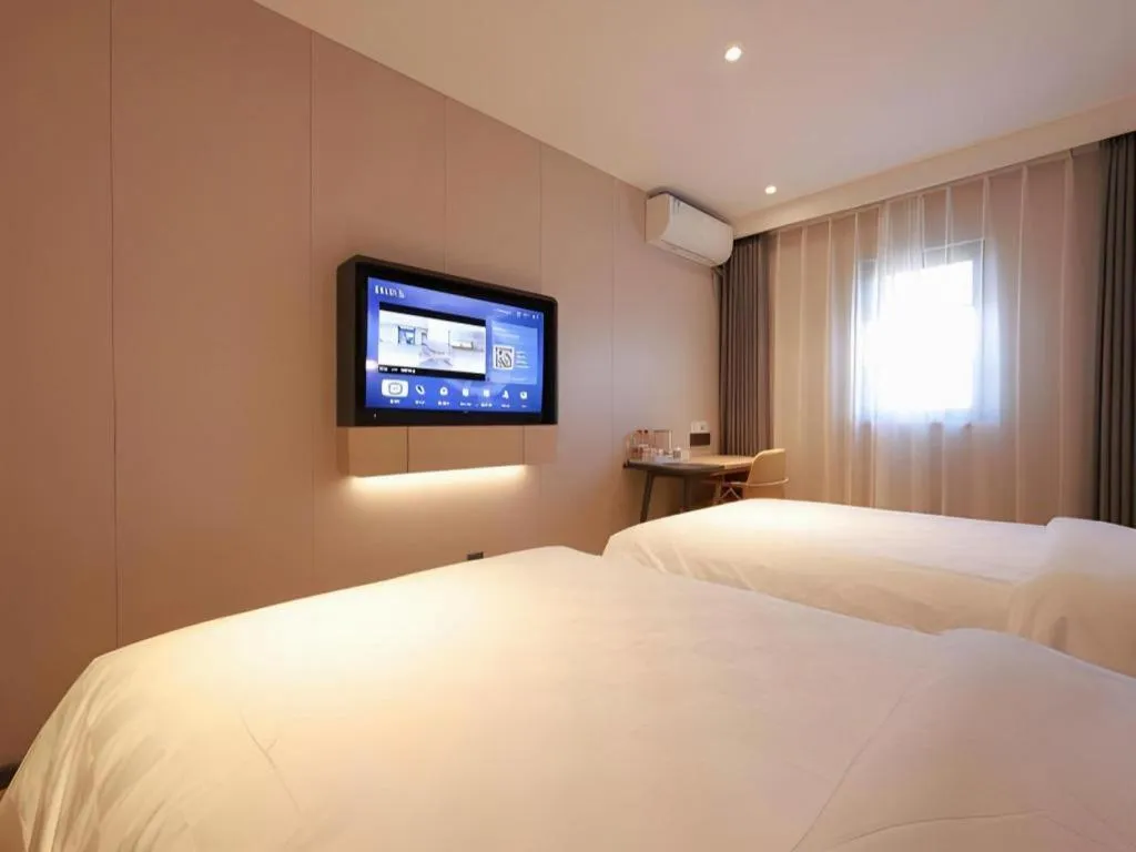 Bed in Jinjiang Inn Beijing Capital International Airport New Expo Metro Station