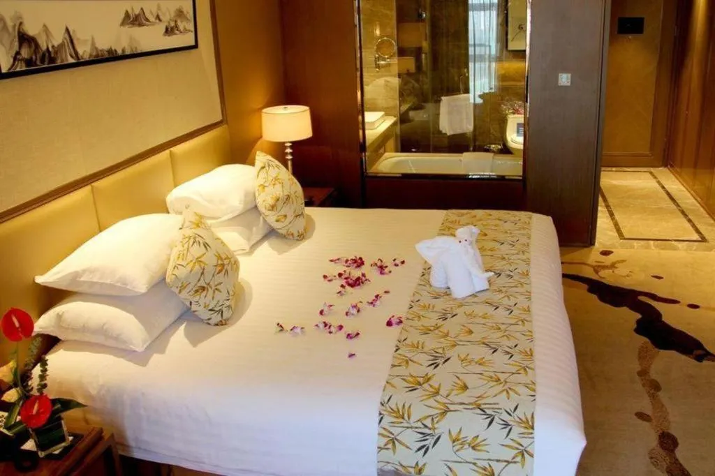 Bed in New Century Grand Hotel Hangzhou Zheshang
