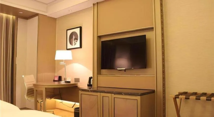 Bed in New Century Grand Hotel Hangzhou Zheshang