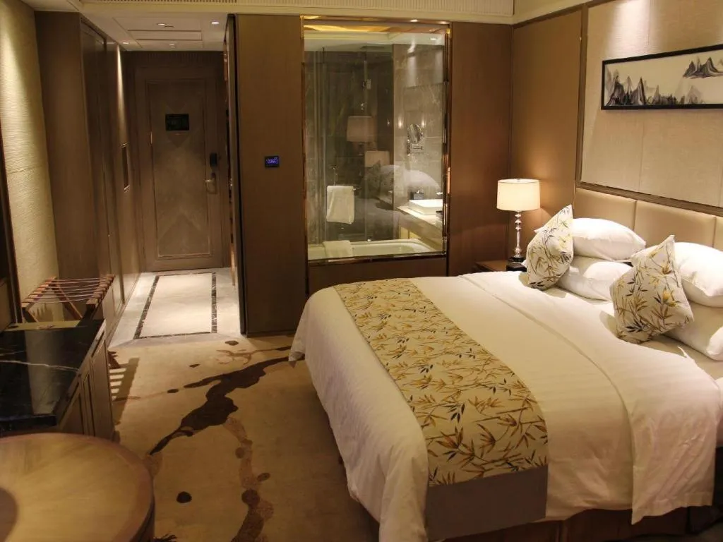 Bed in New Century Grand Hotel Hangzhou Zheshang