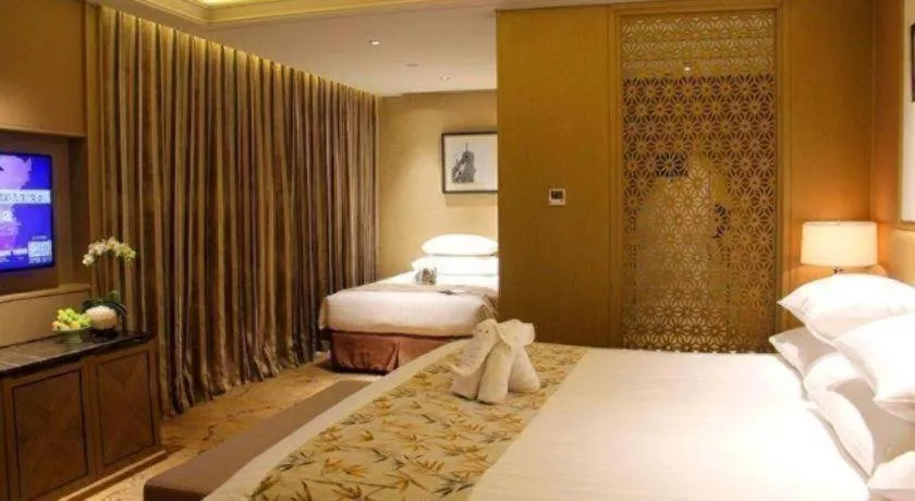 Bed in New Century Grand Hotel Hangzhou Zheshang
