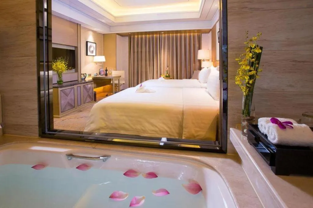 Bed in New Century Grand Hotel Hangzhou Zheshang