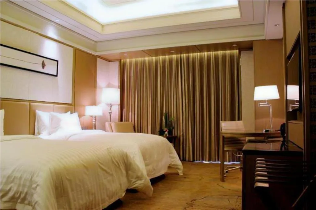 Bed in New Century Grand Hotel Hangzhou Zheshang