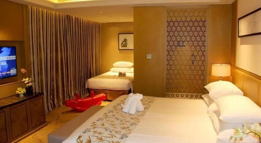 Bed in New Century Grand Hotel Hangzhou Zheshang