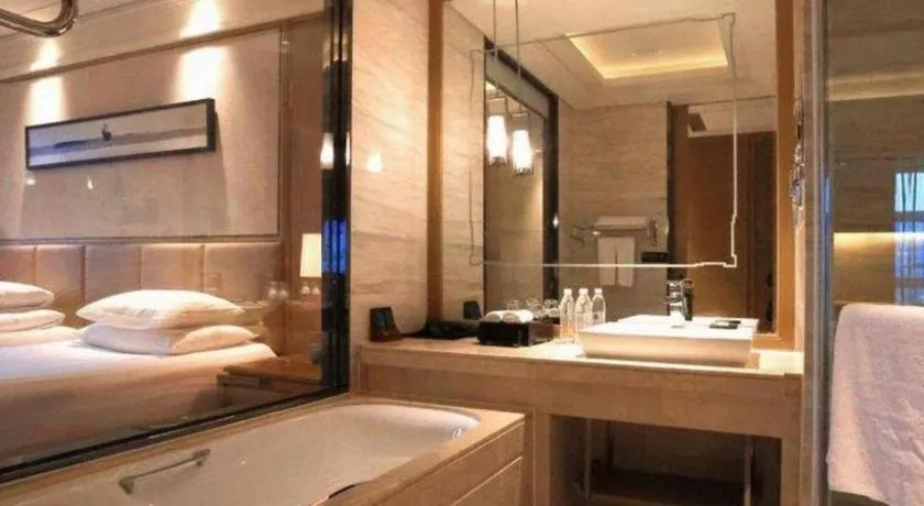 Bed in New Century Grand Hotel Hangzhou Zheshang