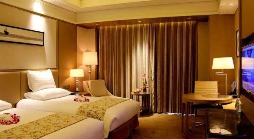 Bed in New Century Grand Hotel Hangzhou Zheshang