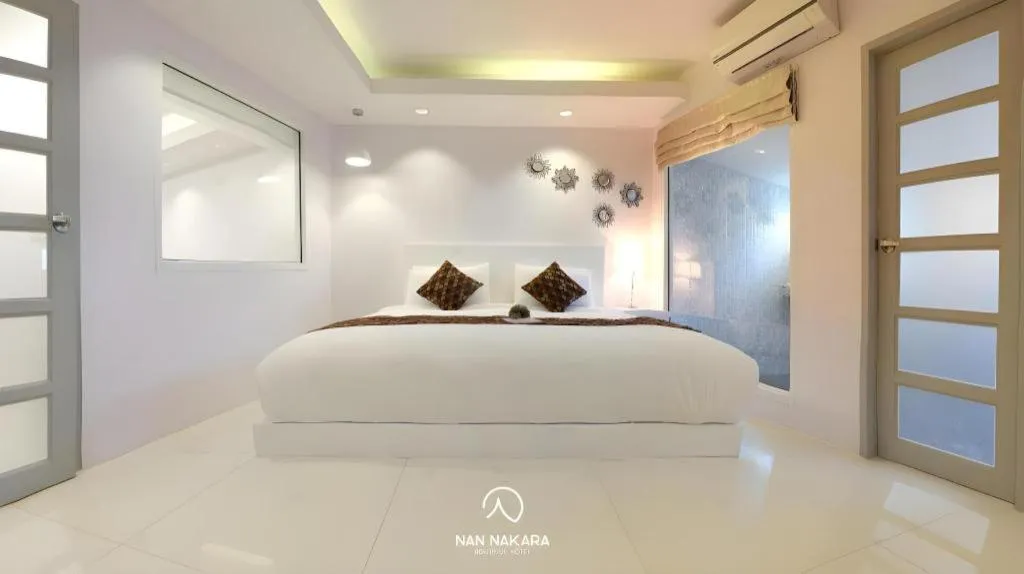 Bed in NanNakara Boutique Hotel