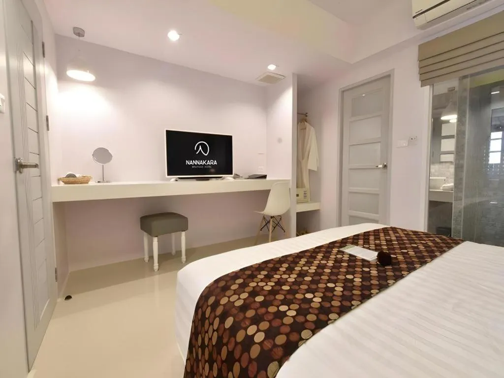 Bed in NanNakara Boutique Hotel