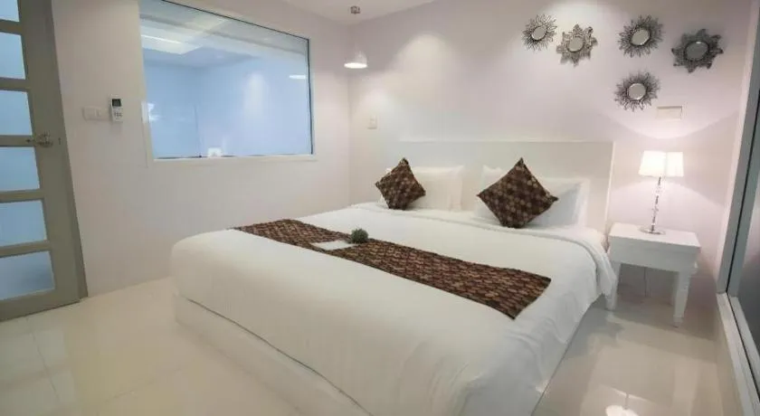 Bed in NanNakara Boutique Hotel