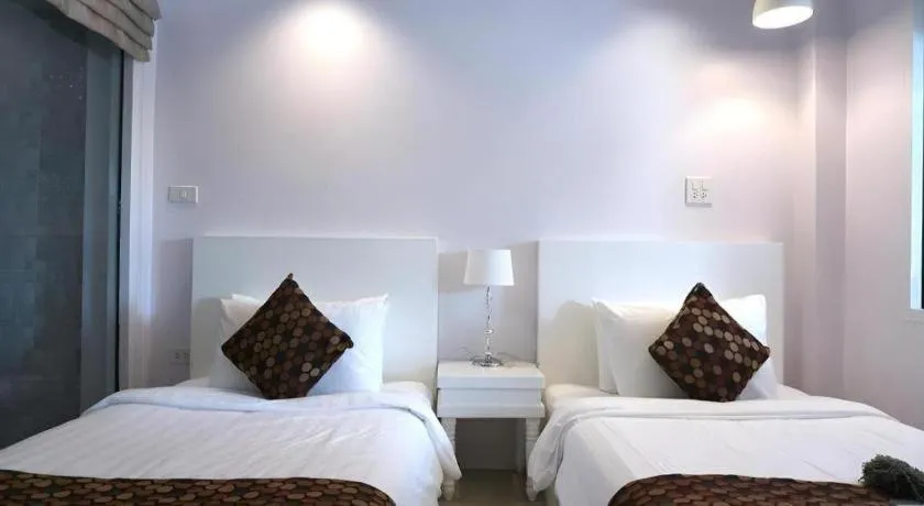 Bed in NanNakara Boutique Hotel