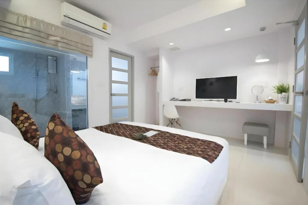 Bed in NanNakara Boutique Hotel
