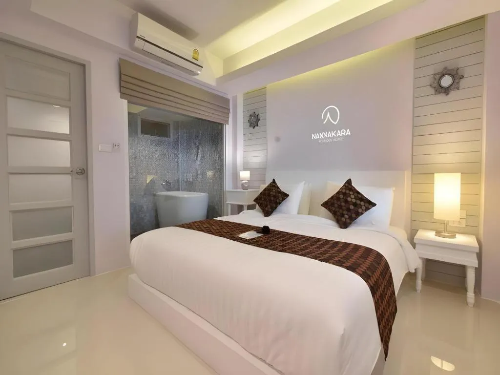 Bed in NanNakara Boutique Hotel