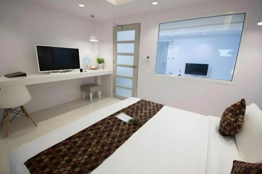 Bed in NanNakara Boutique Hotel