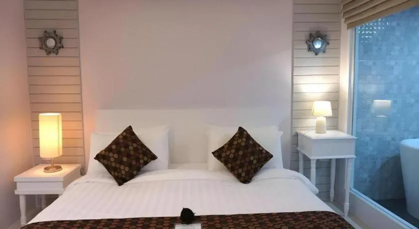 Bed in NanNakara Boutique Hotel