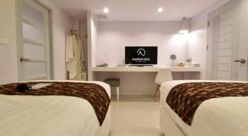 Bed in NanNakara Boutique Hotel