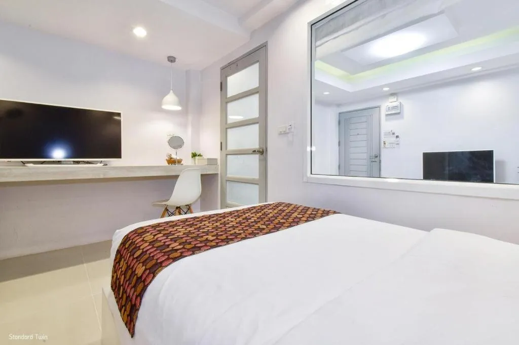 Bed in NanNakara Boutique Hotel