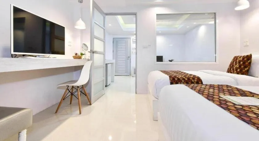 Bed in NanNakara Boutique Hotel