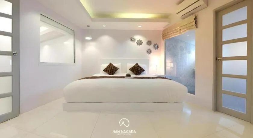 Bed in NanNakara Boutique Hotel