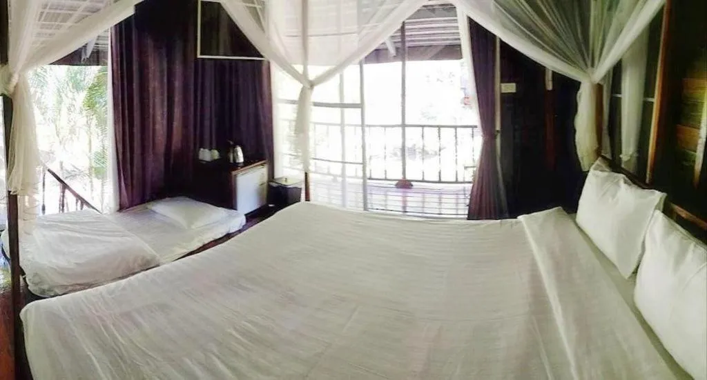 Bed in The White House Boutique Resort