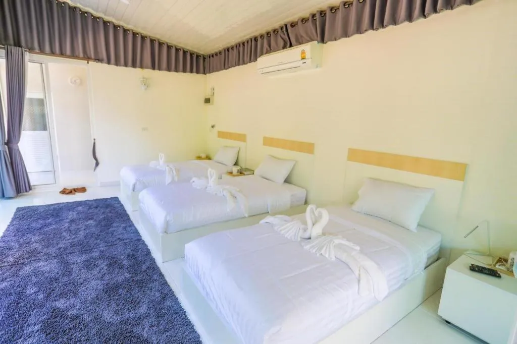 Bed in The White House Boutique Resort