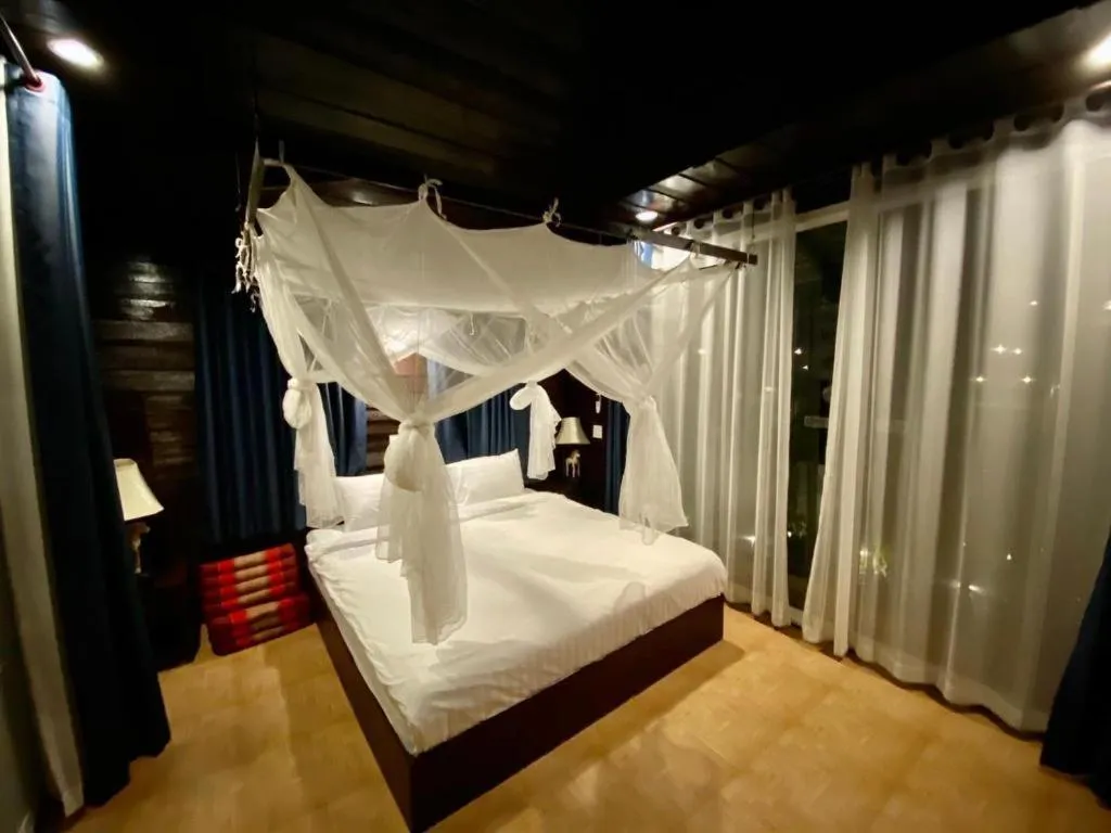 Bed in The White House Boutique Resort