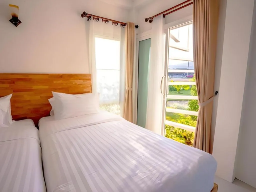 Bed in The White House Boutique Resort