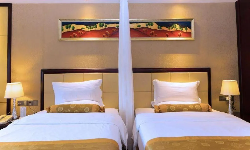 Bed in Taishan Bojue Hotel