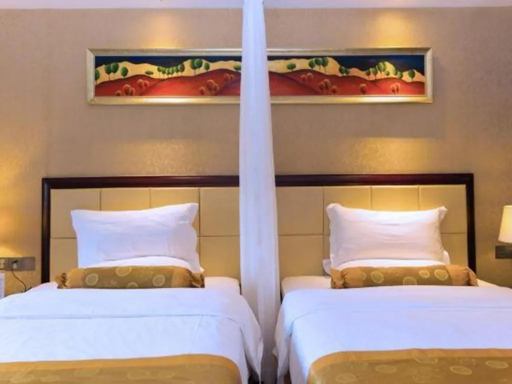 Bed in Taishan Bojue Hotel