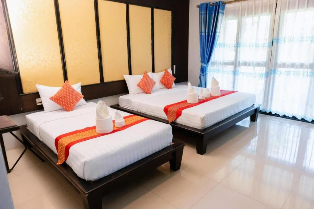 Bed in Poochommhok Resort