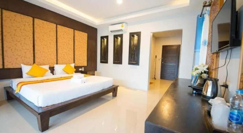 Bed in Poochommhok Resort