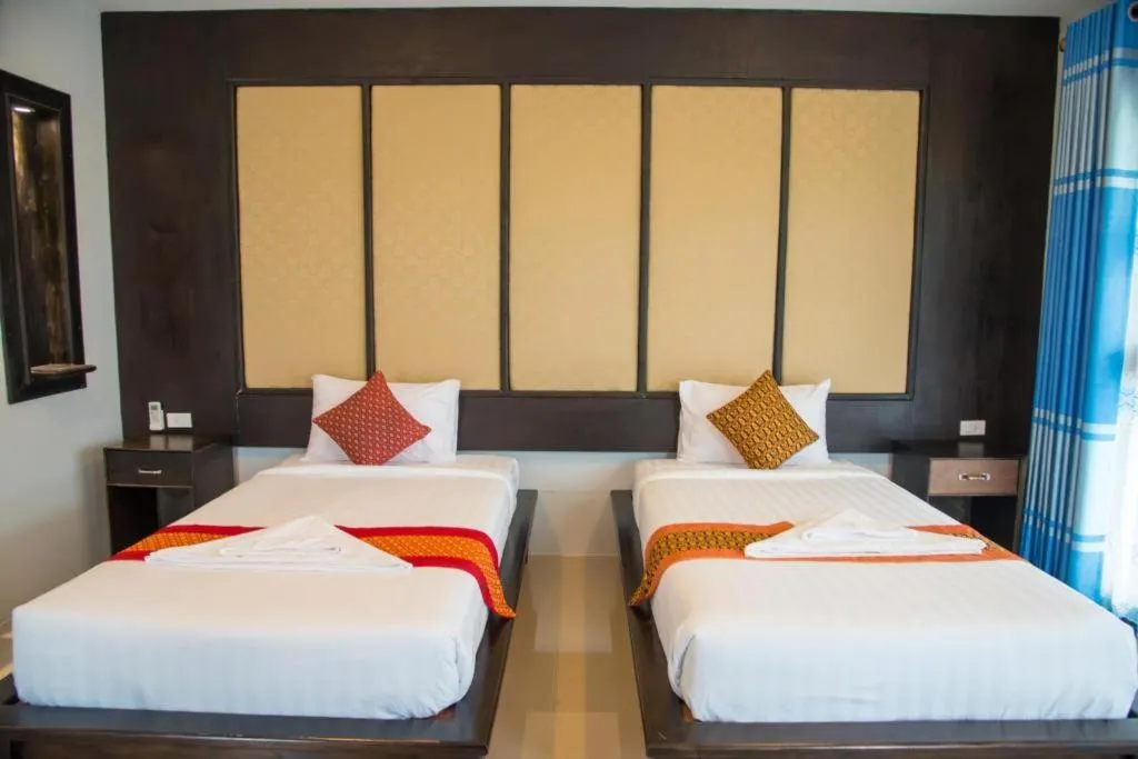 Bed in Poochommhok Resort