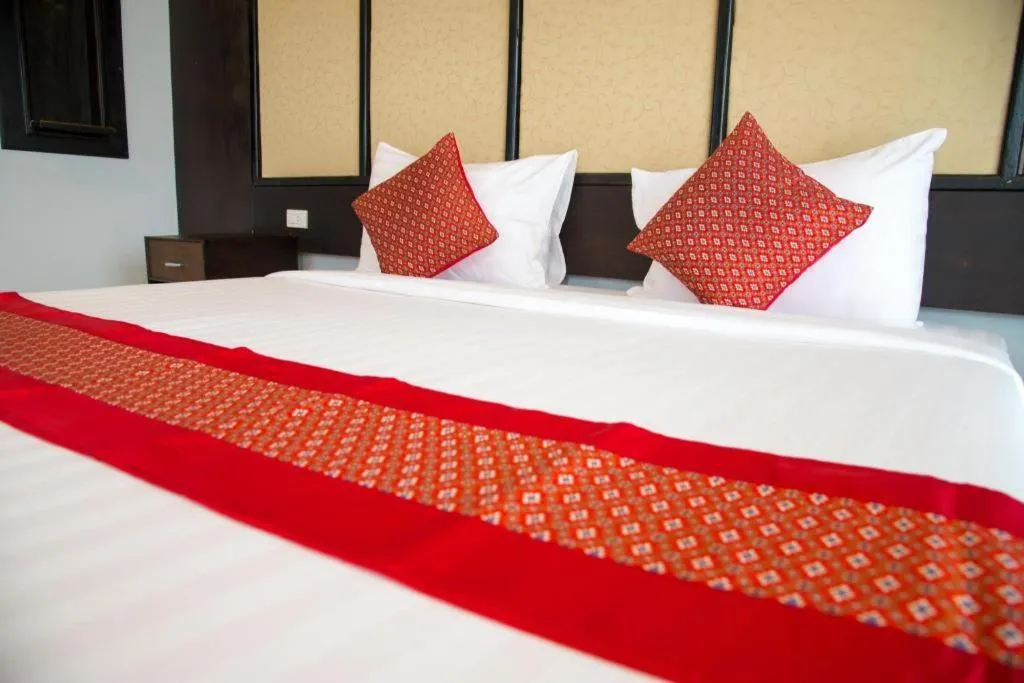 Bed in Poochommhok Resort