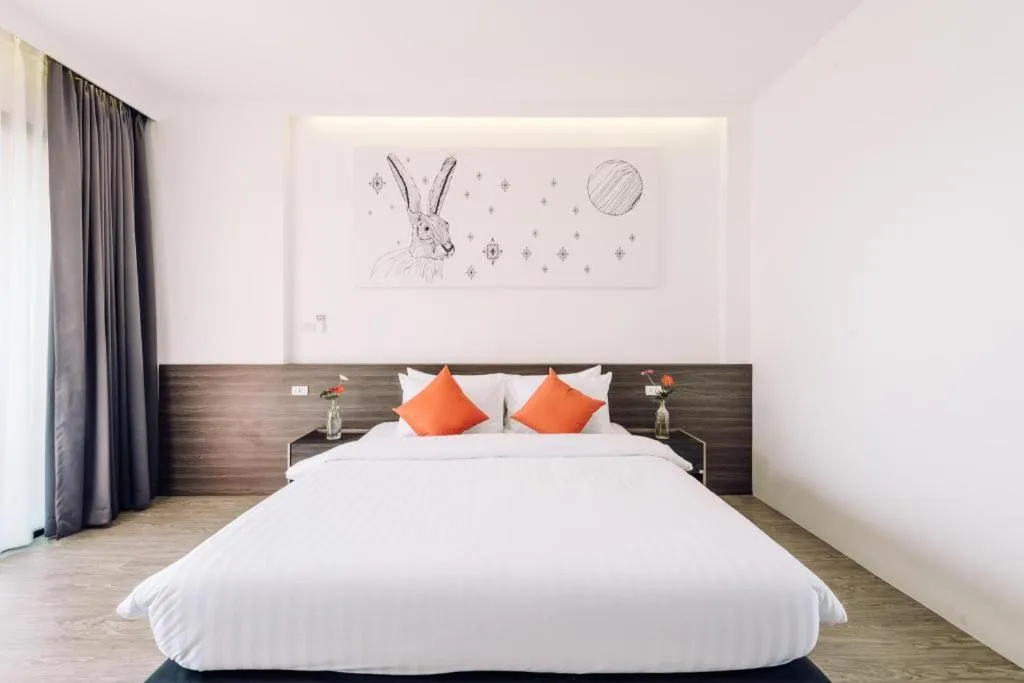 Bed in PIMDARA HOTEL