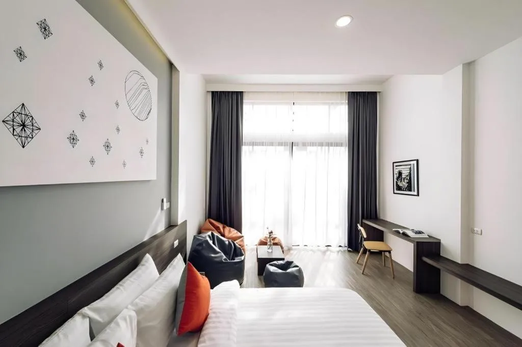 Bed in PIMDARA HOTEL