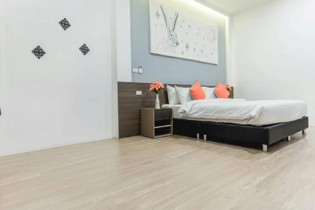 Bed in PIMDARA HOTEL