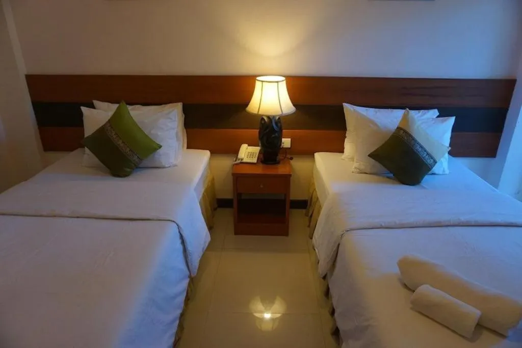 Bed in Sirimathani Hotel