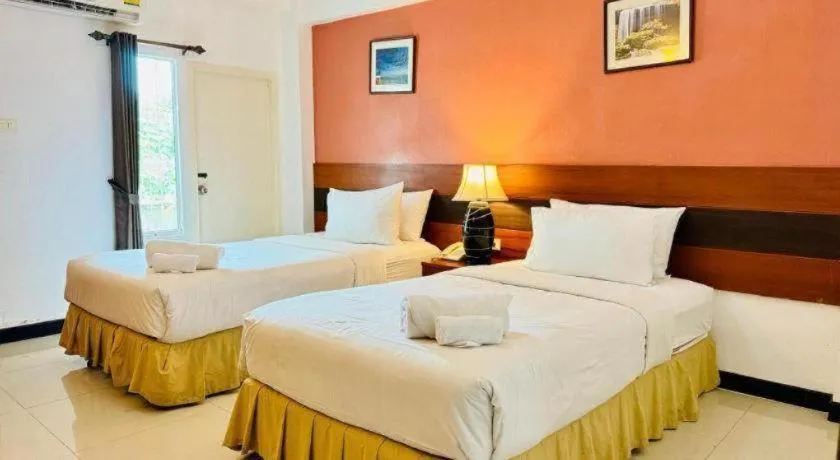 Bed in Sirimathani Hotel