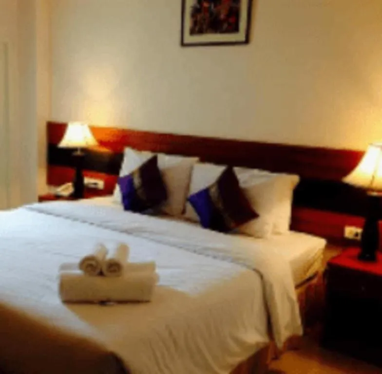 Bed in Sirimathani Hotel