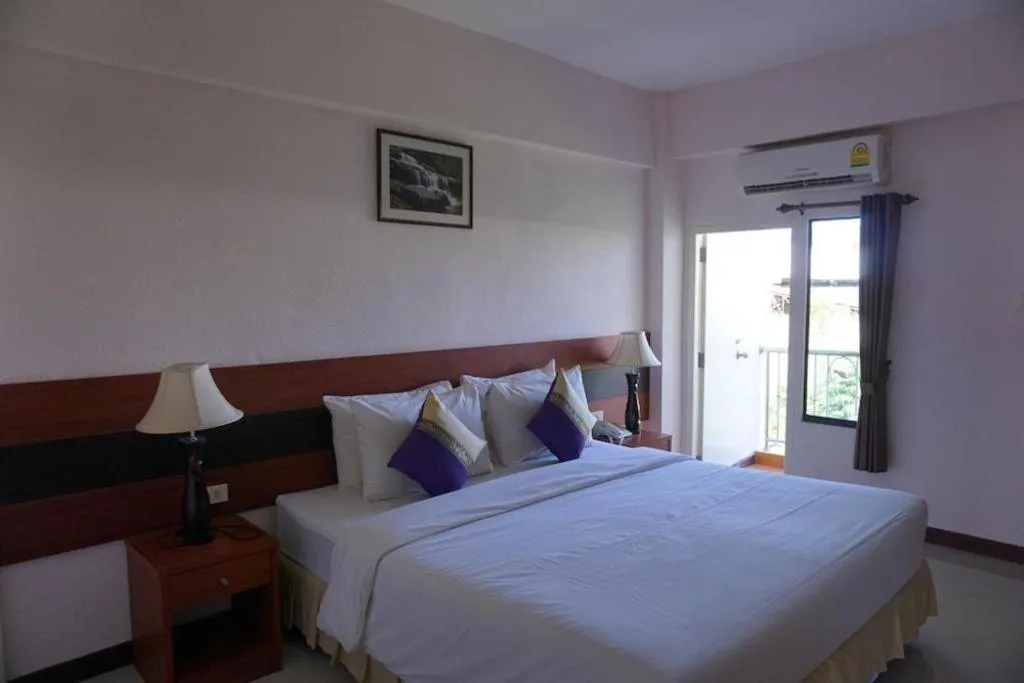 Bed in Sirimathani Hotel