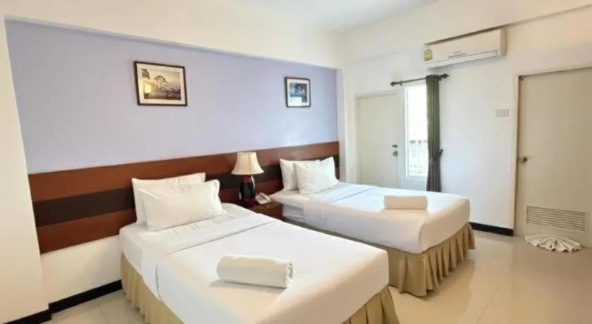 Bed in Sirimathani Hotel