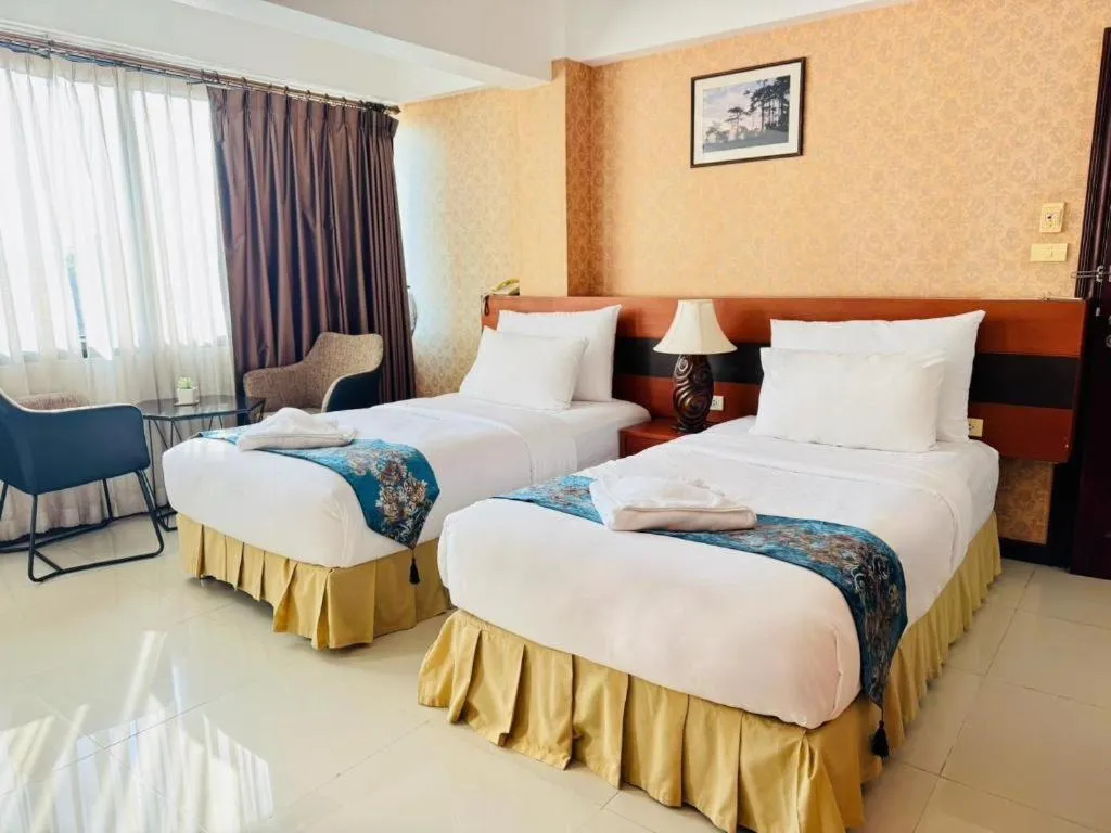 Bed in Sirimathani Hotel