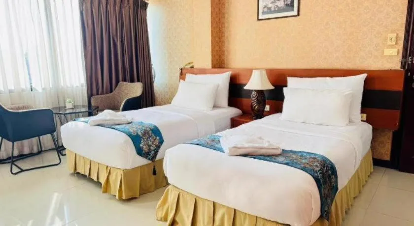 Bed in Sirimathani Hotel