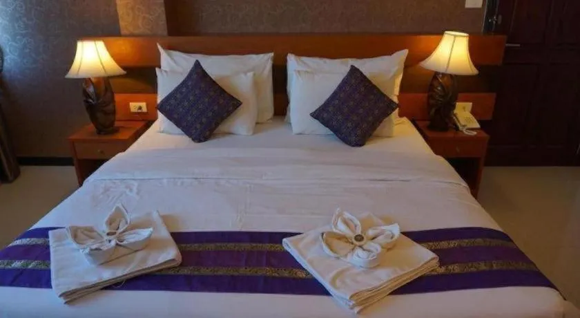 Bed in Sirimathani Hotel
