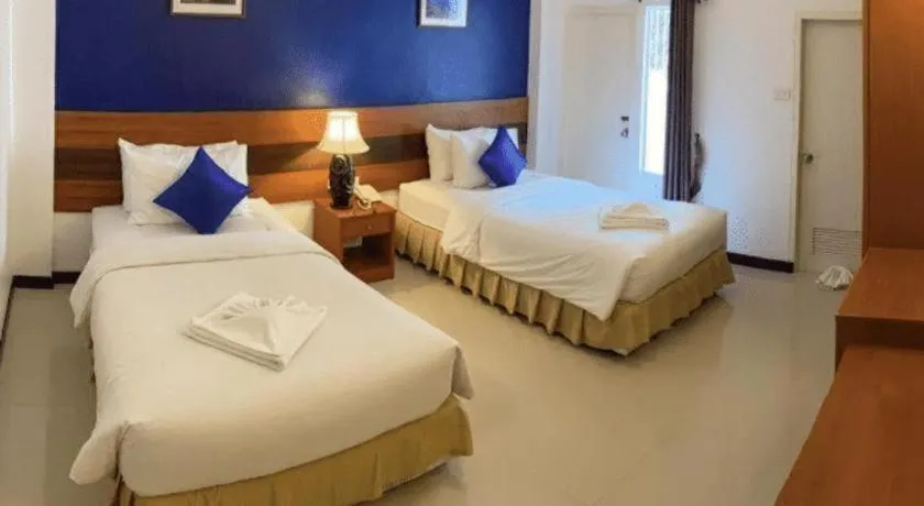 Bed in Sirimathani Hotel