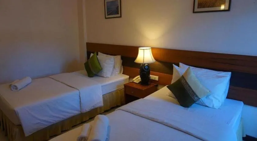 Bed in Sirimathani Hotel