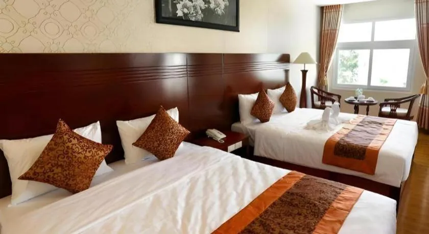 Bed in New Palace Bac Lieu Hotel