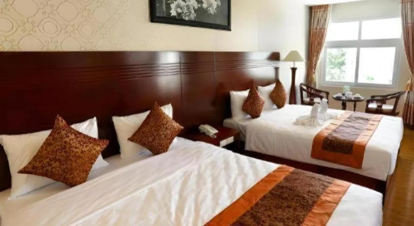 Bed in New Palace Bac Lieu Hotel