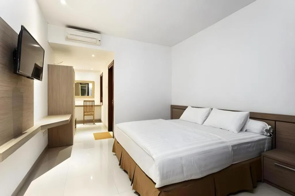 Bed in Hotel Adilla Syariah Ambarukmo