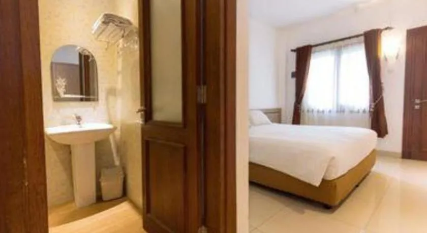 Bed in Hotel Adilla Syariah Ambarukmo