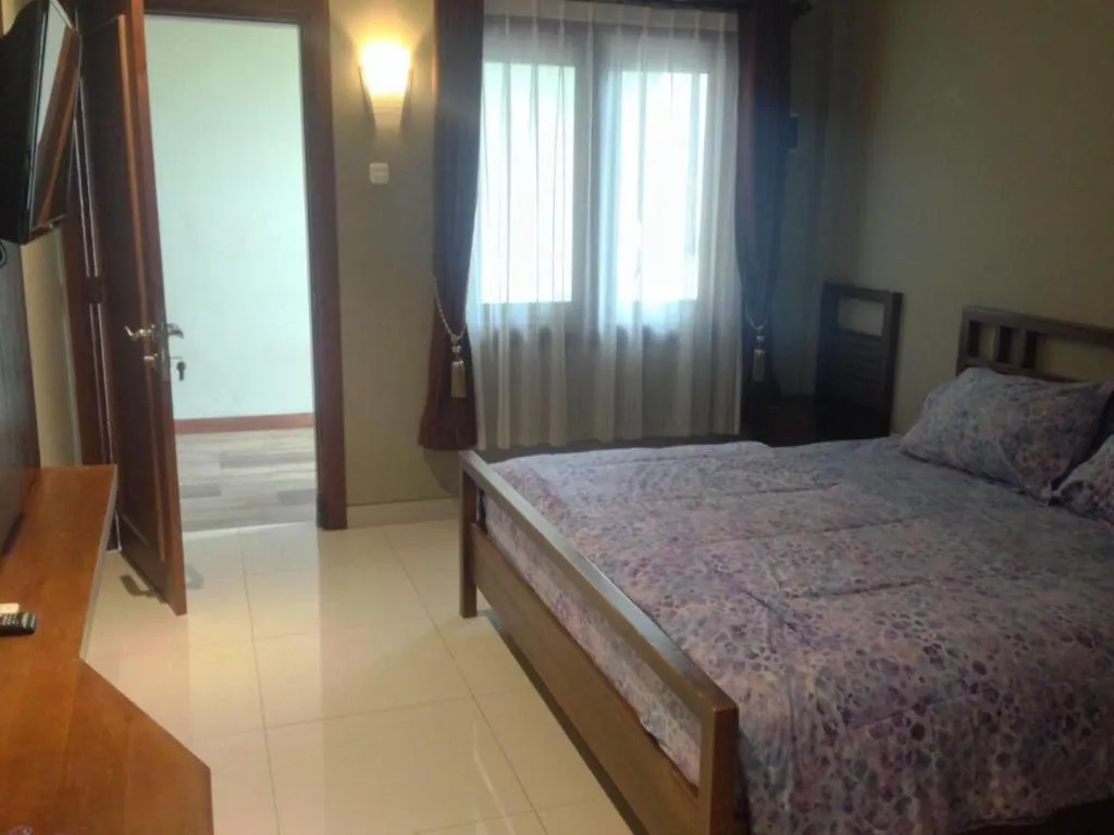 Bed in Hotel Adilla Syariah Ambarukmo